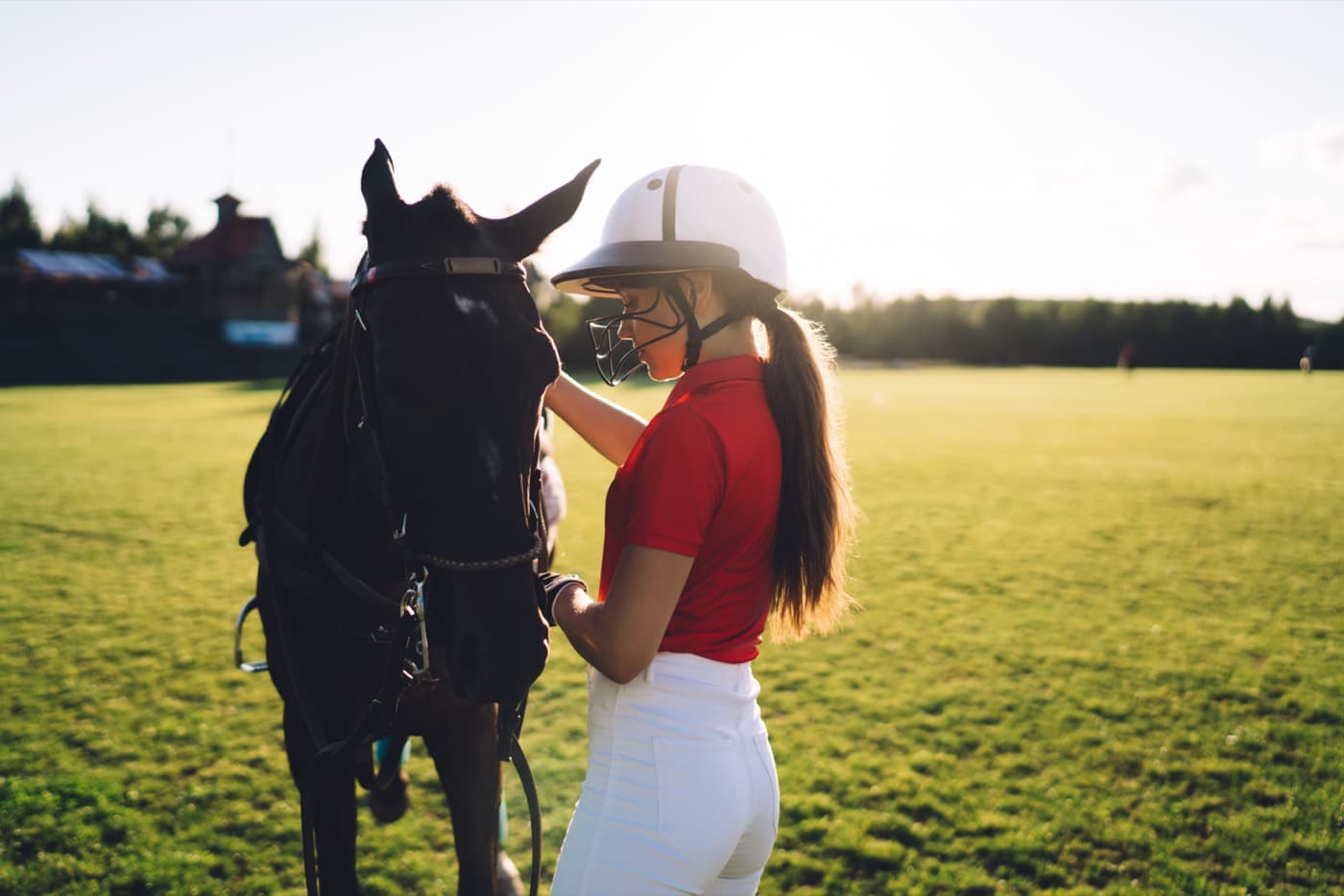 A player with her pony at golden hour